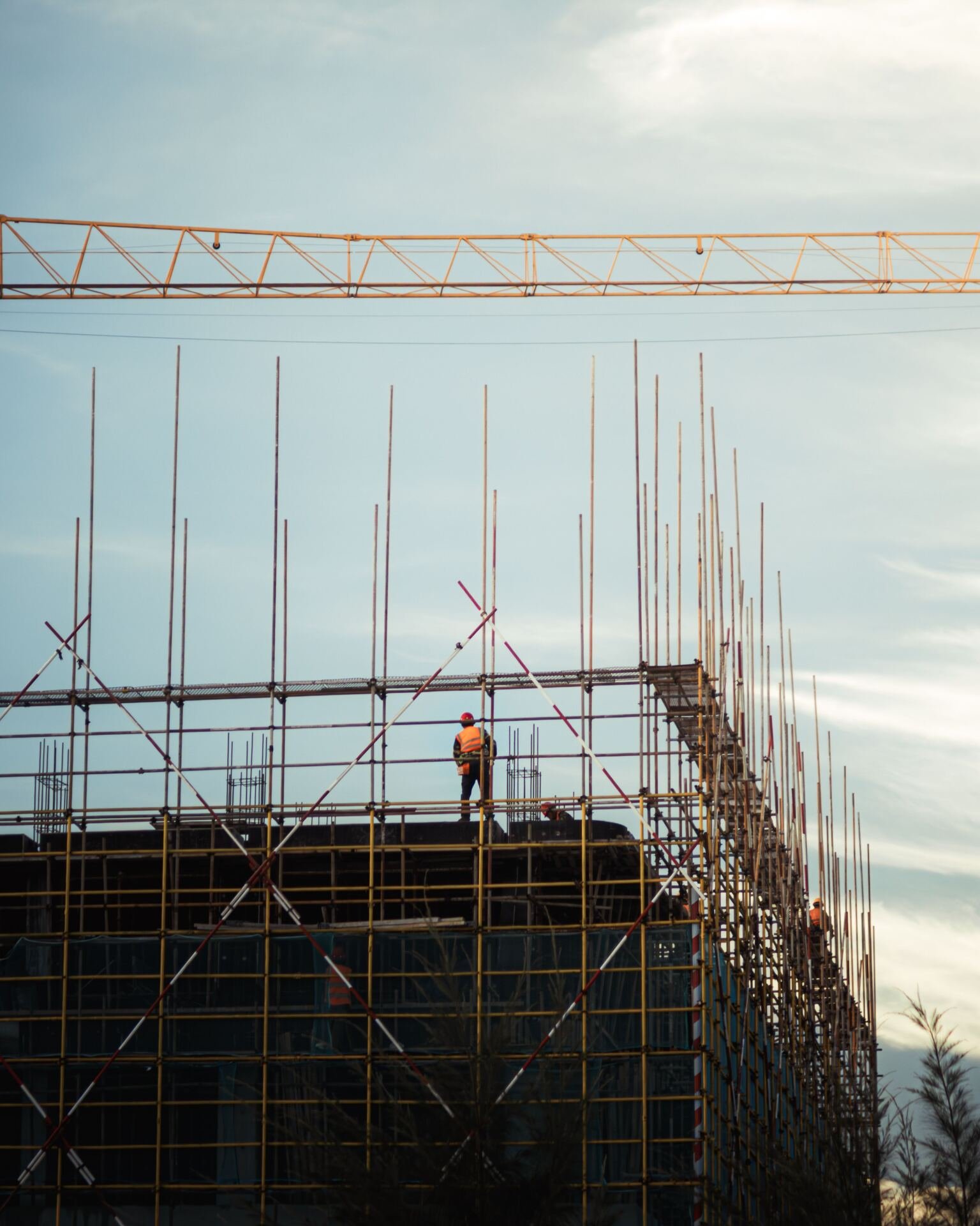 Worker on scaffolding at a construction site